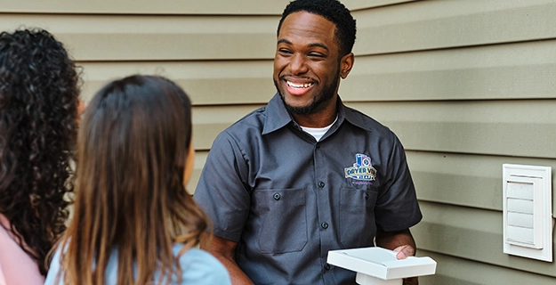 Technician speaking with customers.