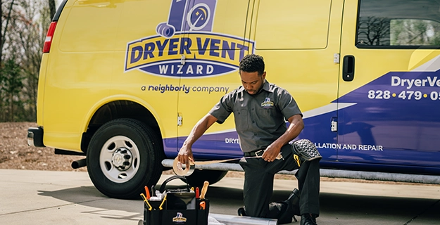 Technician grabbing tools from toolbox.