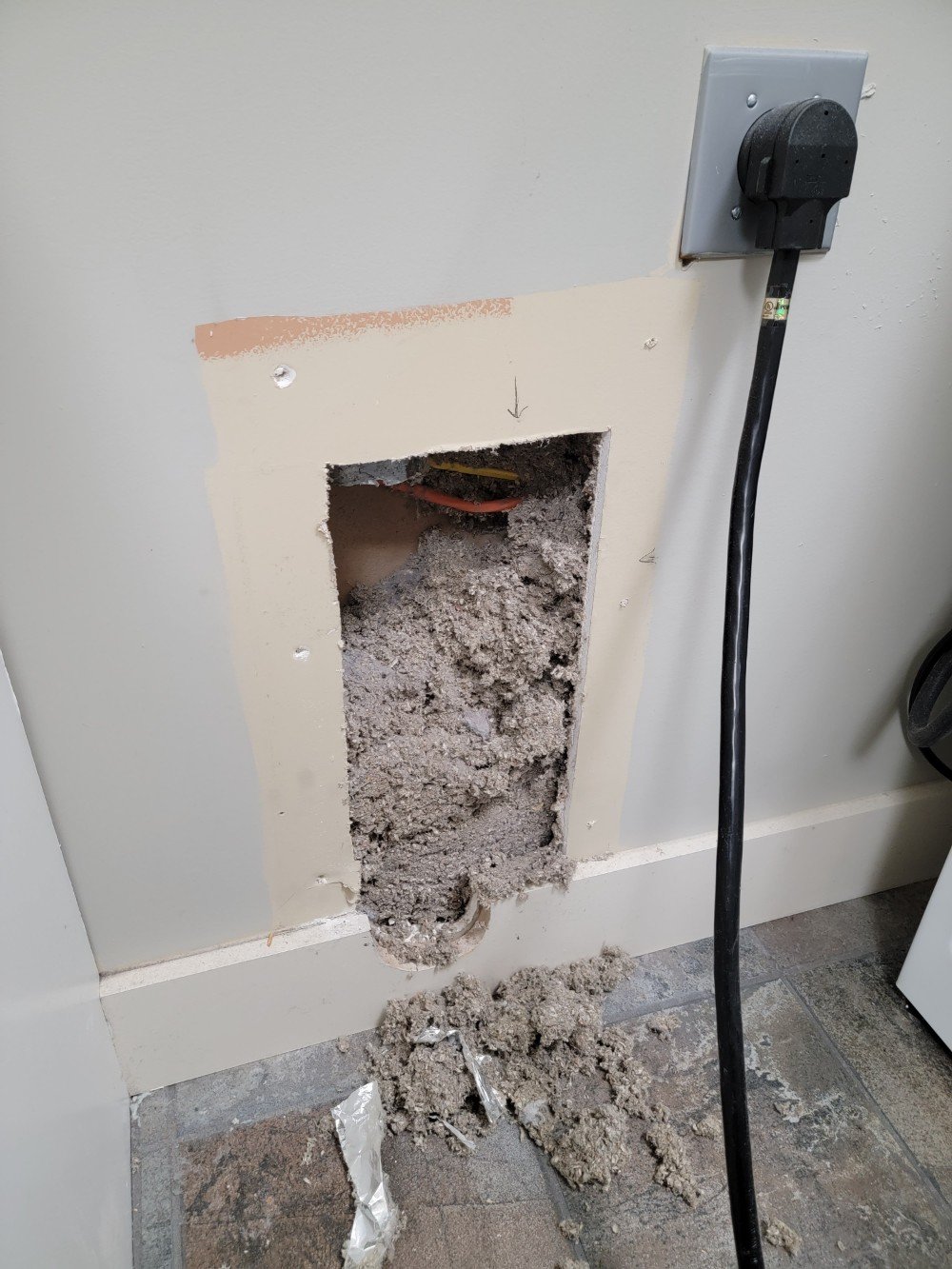 Broken Dryer Vent Results in Lint in the Wall