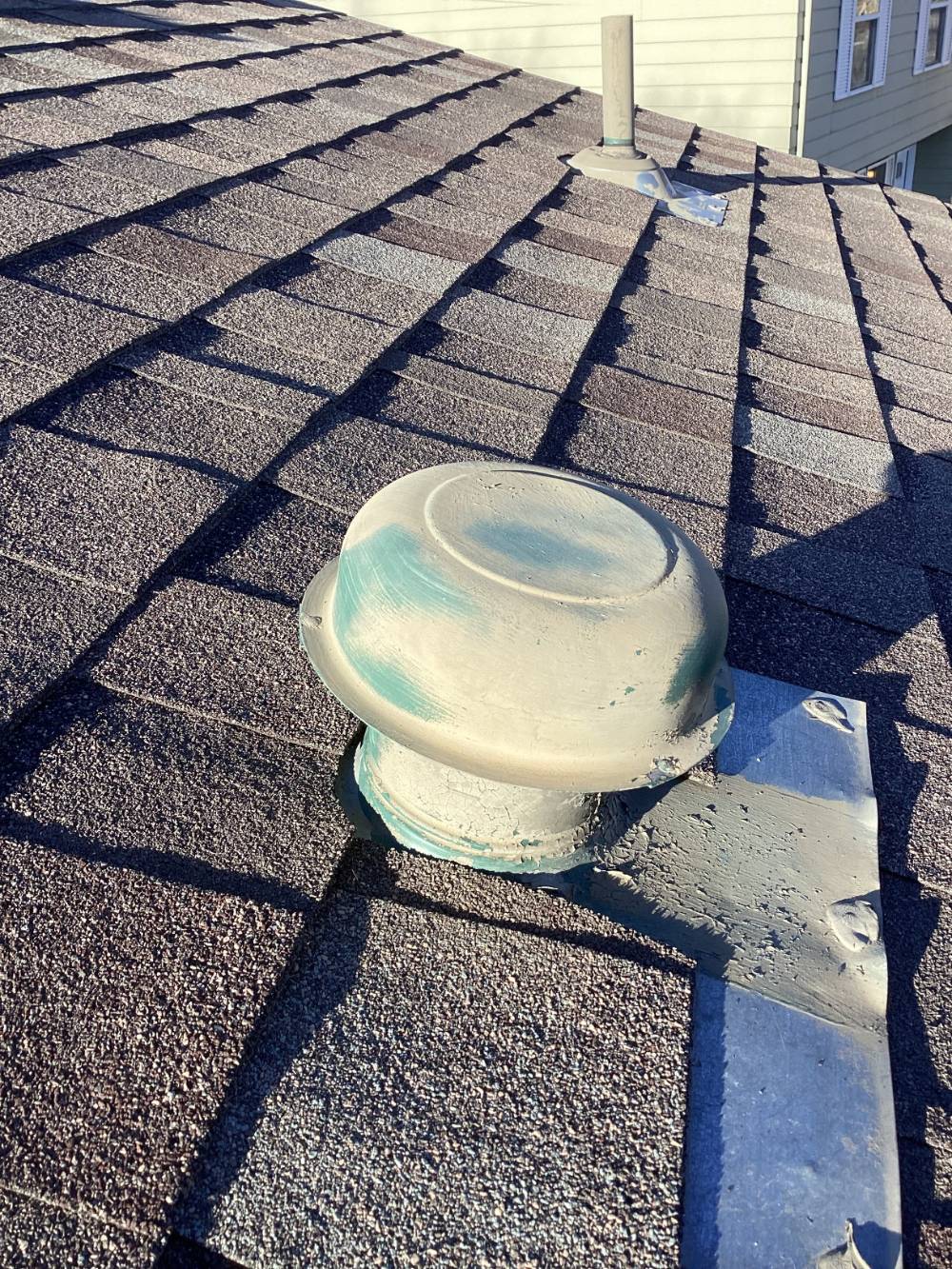non-code compliant roof dome cap for a dryer vent system, lacking dampers and creating blockages