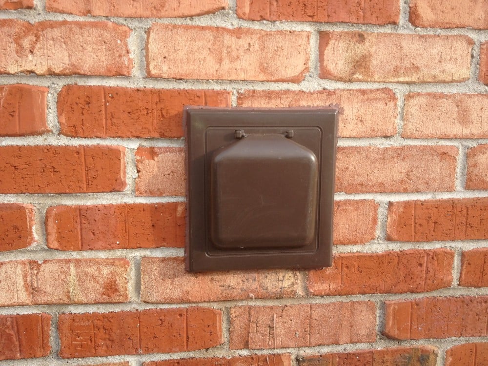 New pest-proof vent cover mounted on brick in Detroit.
